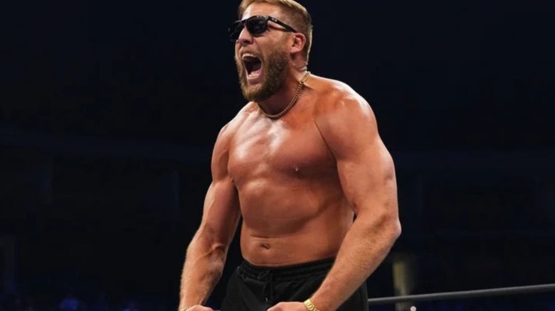 Jake Hager stands in the ring, wearing sunglasses, during an episode of AEW TV.
