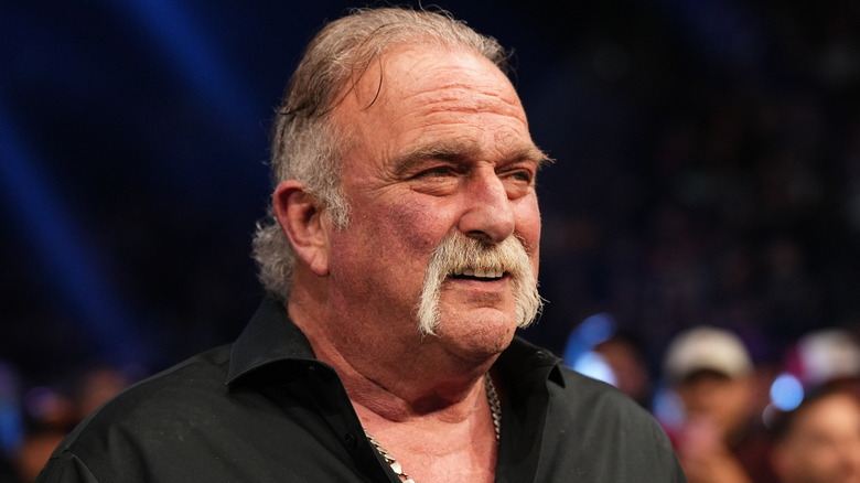 Jake Roberts smiles at his adversary