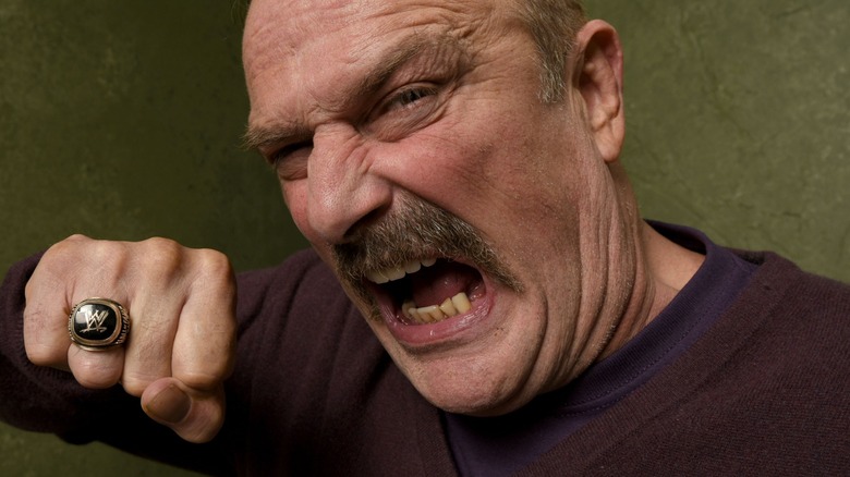 Jake Roberts Poses With His WWE HOF Ring