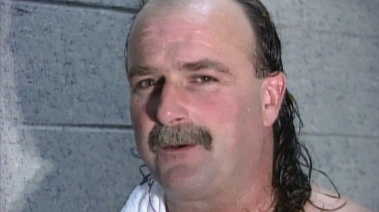 Jake Roberts cuts a promo in 1996 WWE