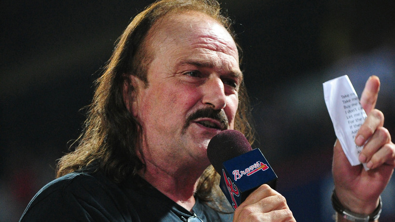 Jake Roberts talking into a microphone