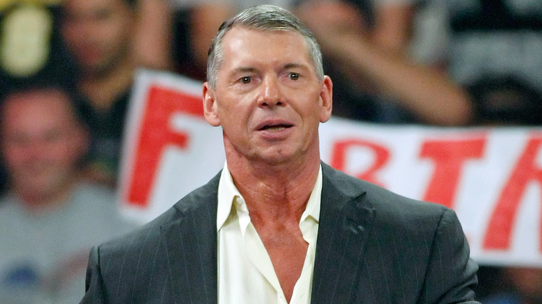 Vince McMahon standing in front of an audience