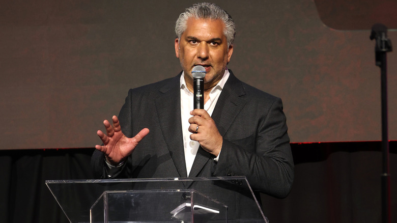 Nick Khan speaks at a conference
