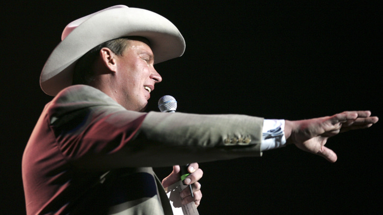 JBL speaking and extending his arm
