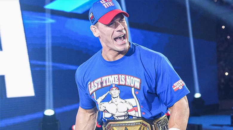 John Cena entering SummerSlam with the Undisputed WWE Championship around his waist.