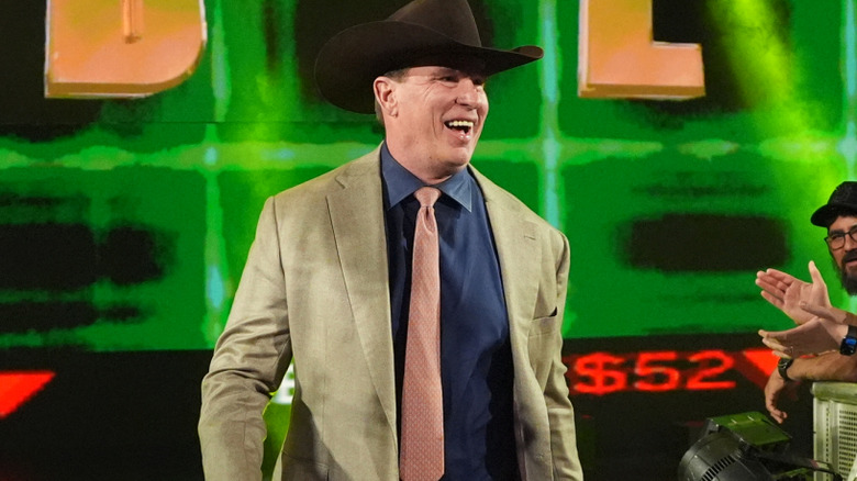 JBL smiles widely as he approaches the ring.