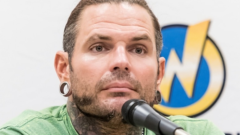 Jeff Hardy staring out into the crowd with a mic in front of him