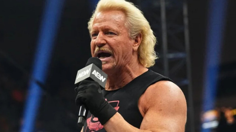 Jeff Jarrett holding a microphone