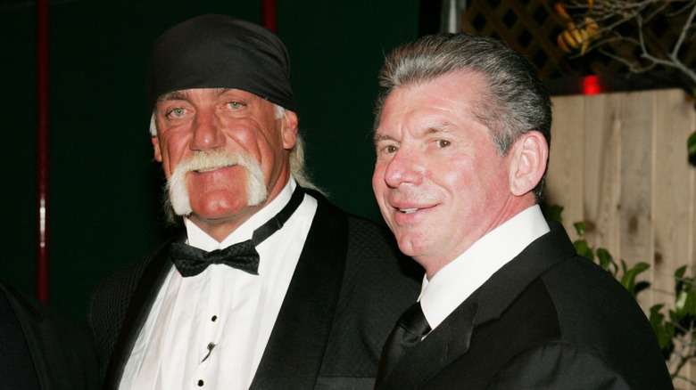 Sylvester Stallone, Hulk Hogan, and Vince McMahon pose for a photo ahead of Hogan's induction into the WWE Hall of Fame.