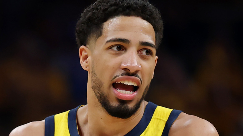 Tyrese Haliburton celebrating on court after the first half of a Indiana Pacers game.