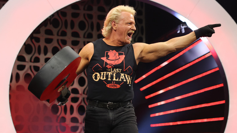 Jeff Jarrett making his entrance with a guitar in hand