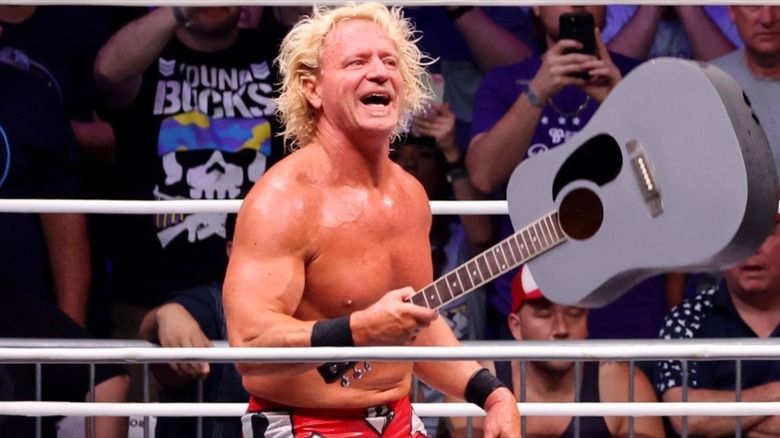 Jeff Jarrett posing with his guitar during the 