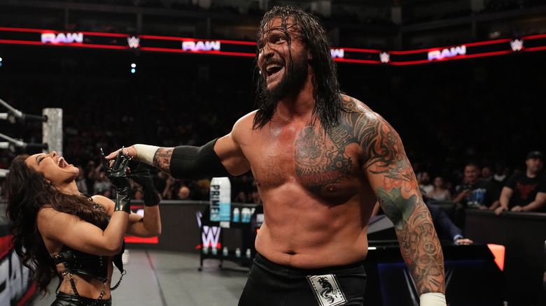Karrion Kross and Scarlett outside the ring on WWE Raw