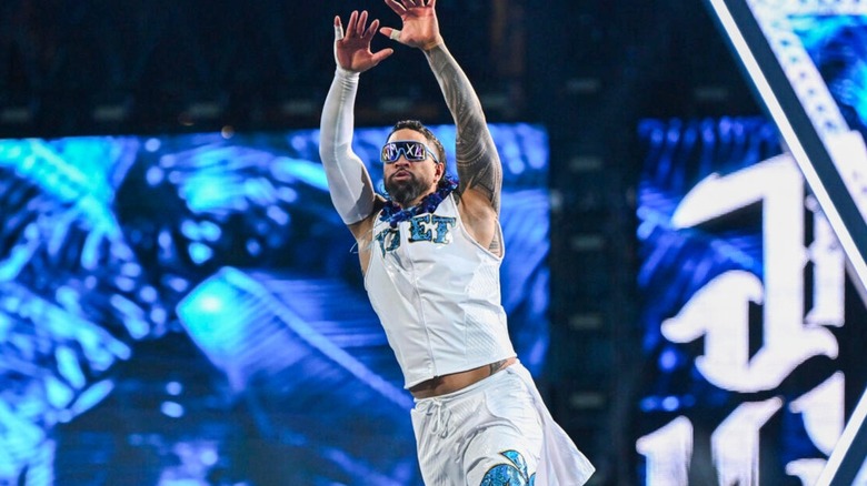 Jey Uso stands on the turnbuckle and poses for fans ahead of his match against brother Jimmy Uso at WrestleMania 40.