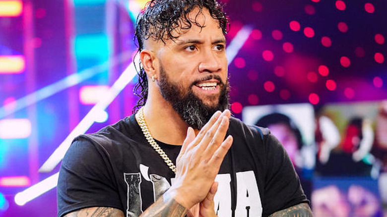 Jey Uso holds hands together