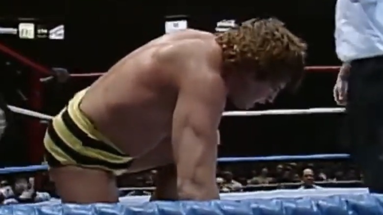 Jim Brunzell kneeling in pain