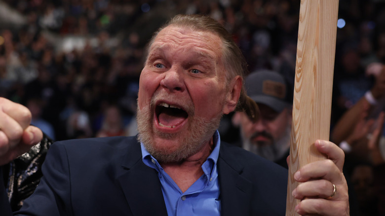 Hacksaw Jim Duggan with his two by four
