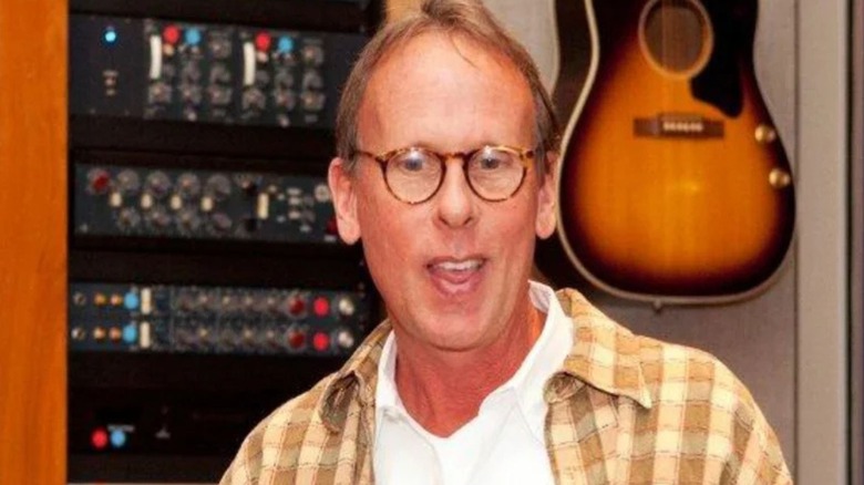 WWE legend and composer Jim Johnston is scene in the studio, guitar behind him, in a photo provided by WWE.
