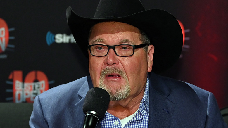 Jim Ross speaking on a microphone