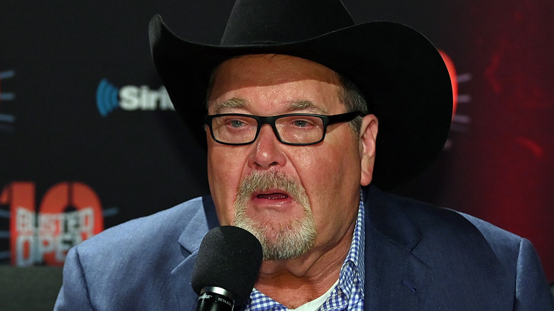 Jim Ross speaking into microphone