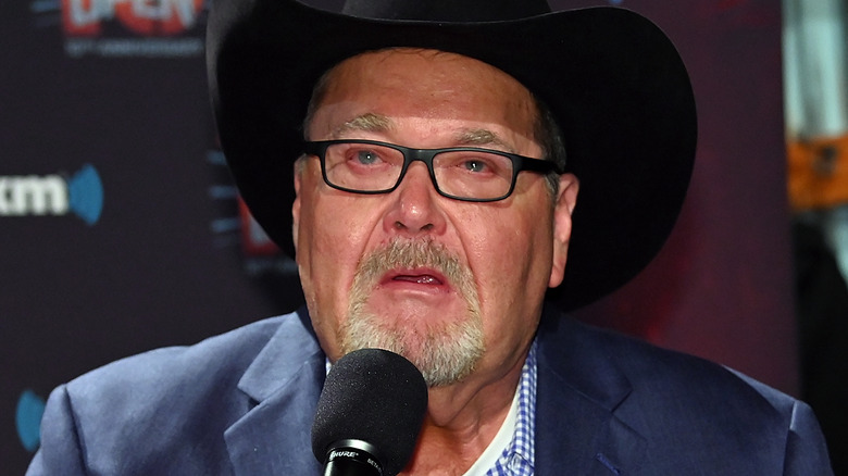 Jim Ross speaking on a microphone