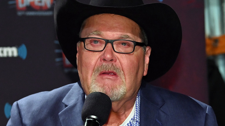 Jim Ross speaking on a microphone