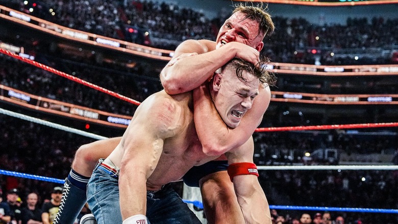 GUNTHER locking John Cena into the headlock that would eventually end their match. 