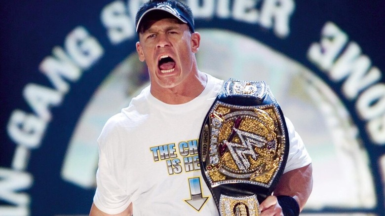 John Cena with the WWE Championship after winning the title for the first time.