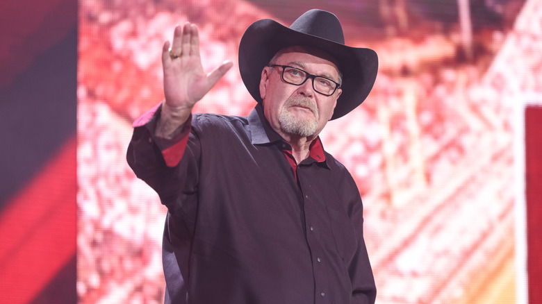 Jim Ross waves at the audience