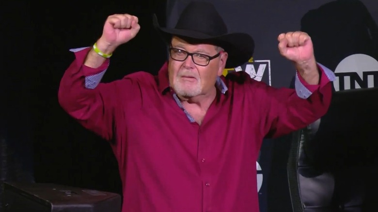 Jim Ross raising his arms in AEW