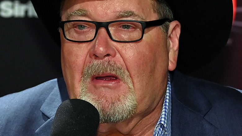 Jim Ross speaking into microphone