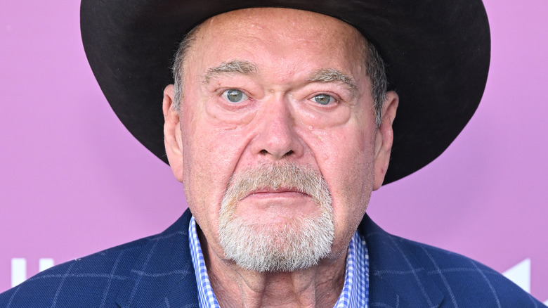 Jim ross wearing a cowboy hat