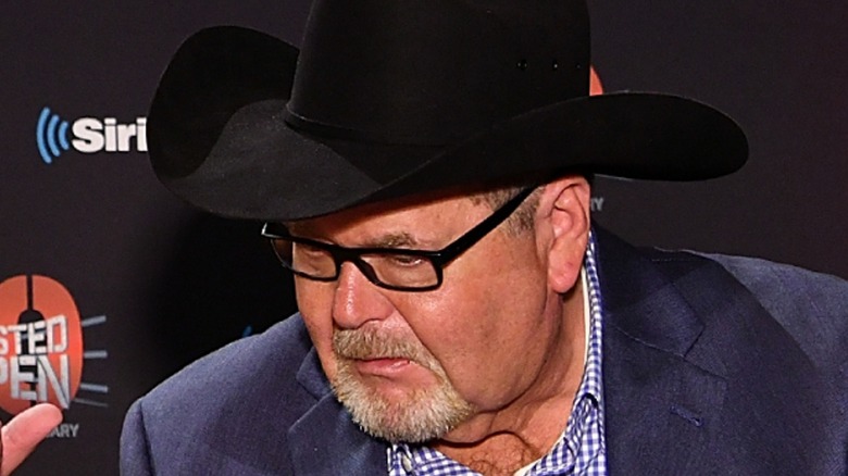 Jim Ross looking downward