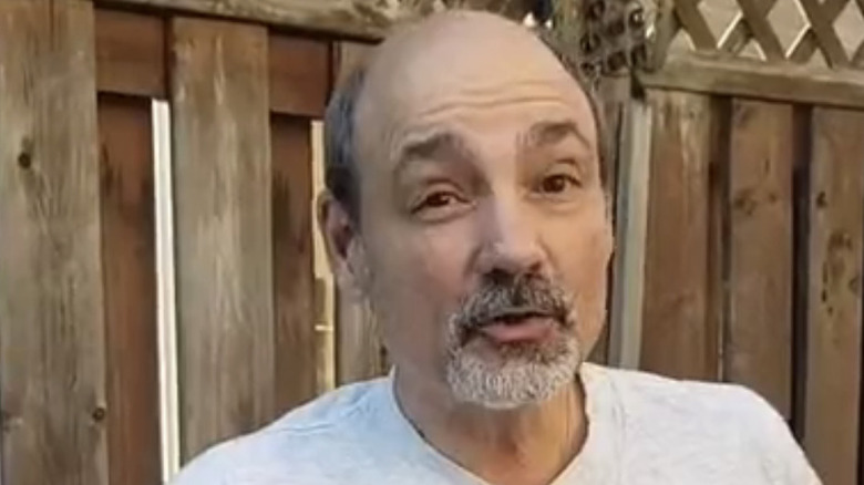 Jimmy Korderas talks in backyard