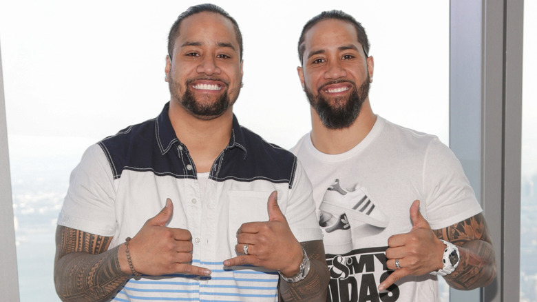Jimmy Uso and Jey Uso are smiling