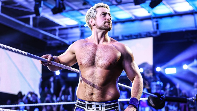 Joe Hendry looks on over to the audience during his entrance to the ring.