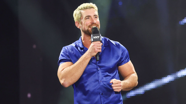 Joe Hendry holding a mic on WWE NXT