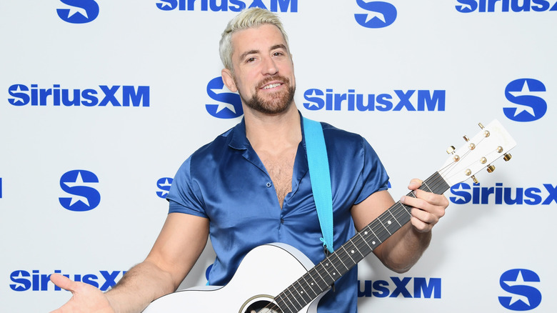 Joe Hendry with his guitar