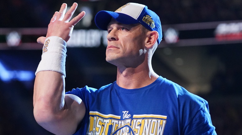 John Cena performing his signature hand gesture