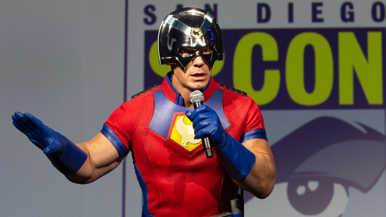 Dressed as Peacemaker, John Cena comes out to talk to fans at the San Diego Comic-Con.