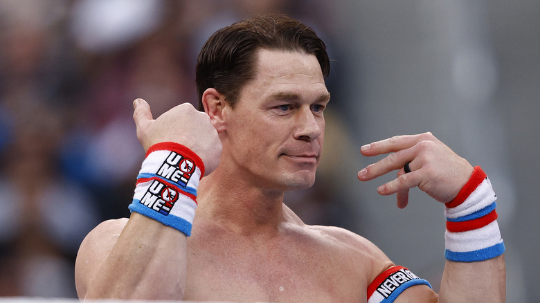 John Cena doing something truly bizarre with his hands