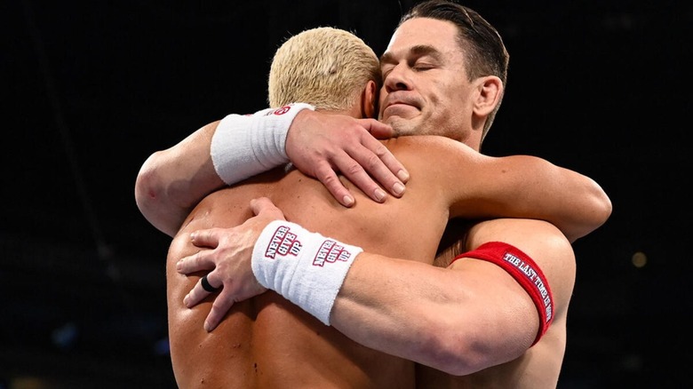 John Cena embraces Cody Rhodes in the ring ahead of their match at WWE SummerSlam 2025.