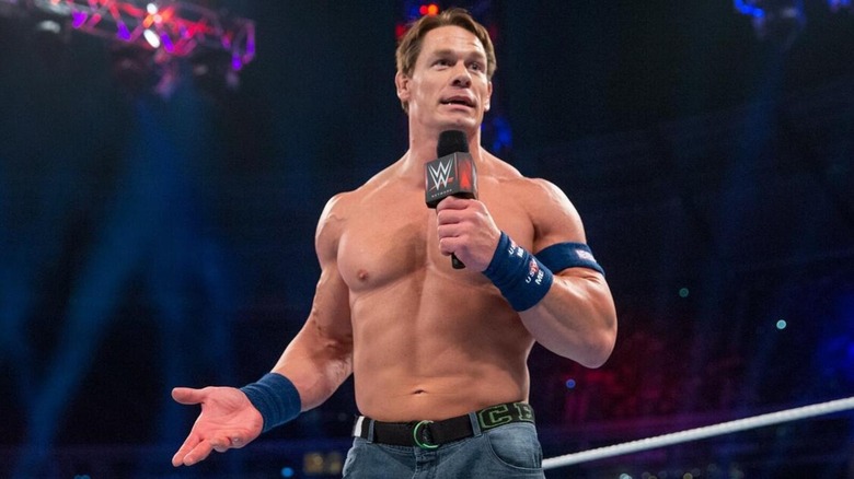 John Cena speaks on the mic during an in-ring promo segment.