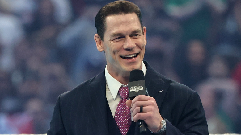 John Cena holding a microphone