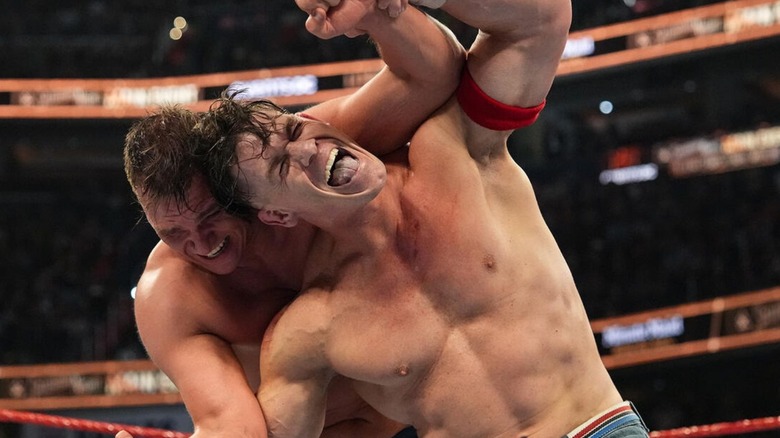 John Cena fights to escape a sleeper hold put on him by GUNTHER during his final match at Saturday Night's Main Event.
