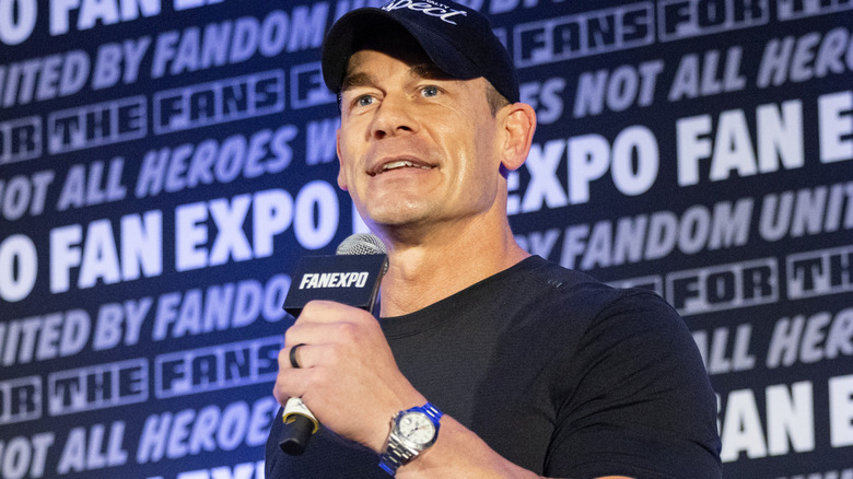 John Cena is holding a microphone