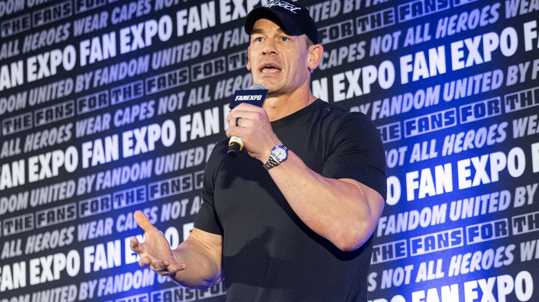 John Cena speaks on a microphone during FanExpo.