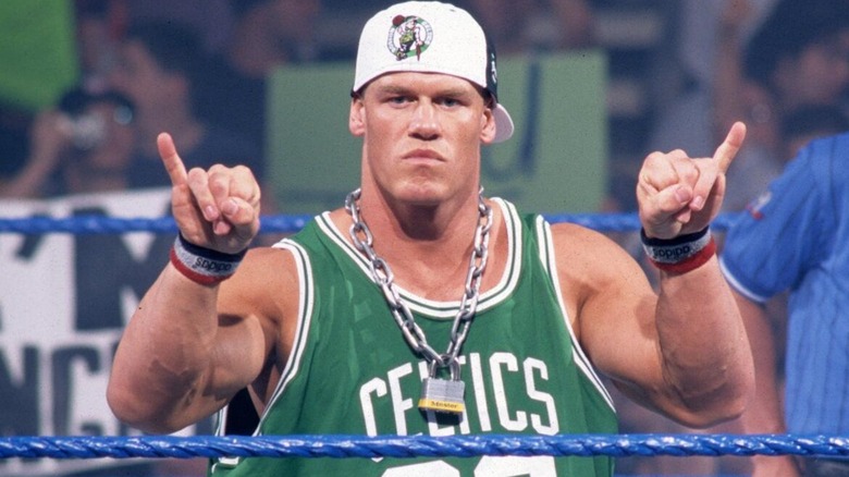 John Cena in ring doing one of his Thuganomics taunts ahead of a match on 