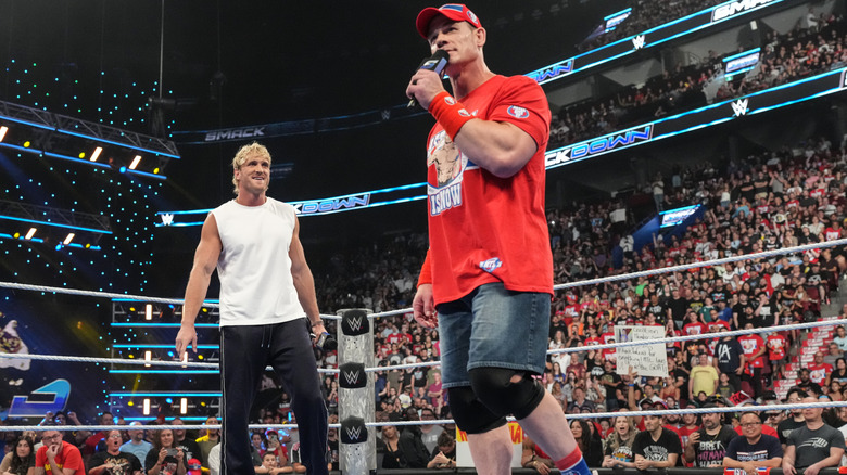 John Cena speaking to Logan Paul in the ring on 