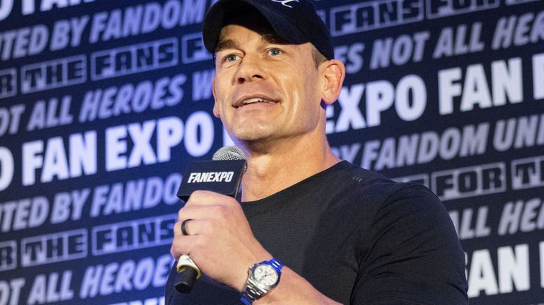 John Cena is holding a microphone